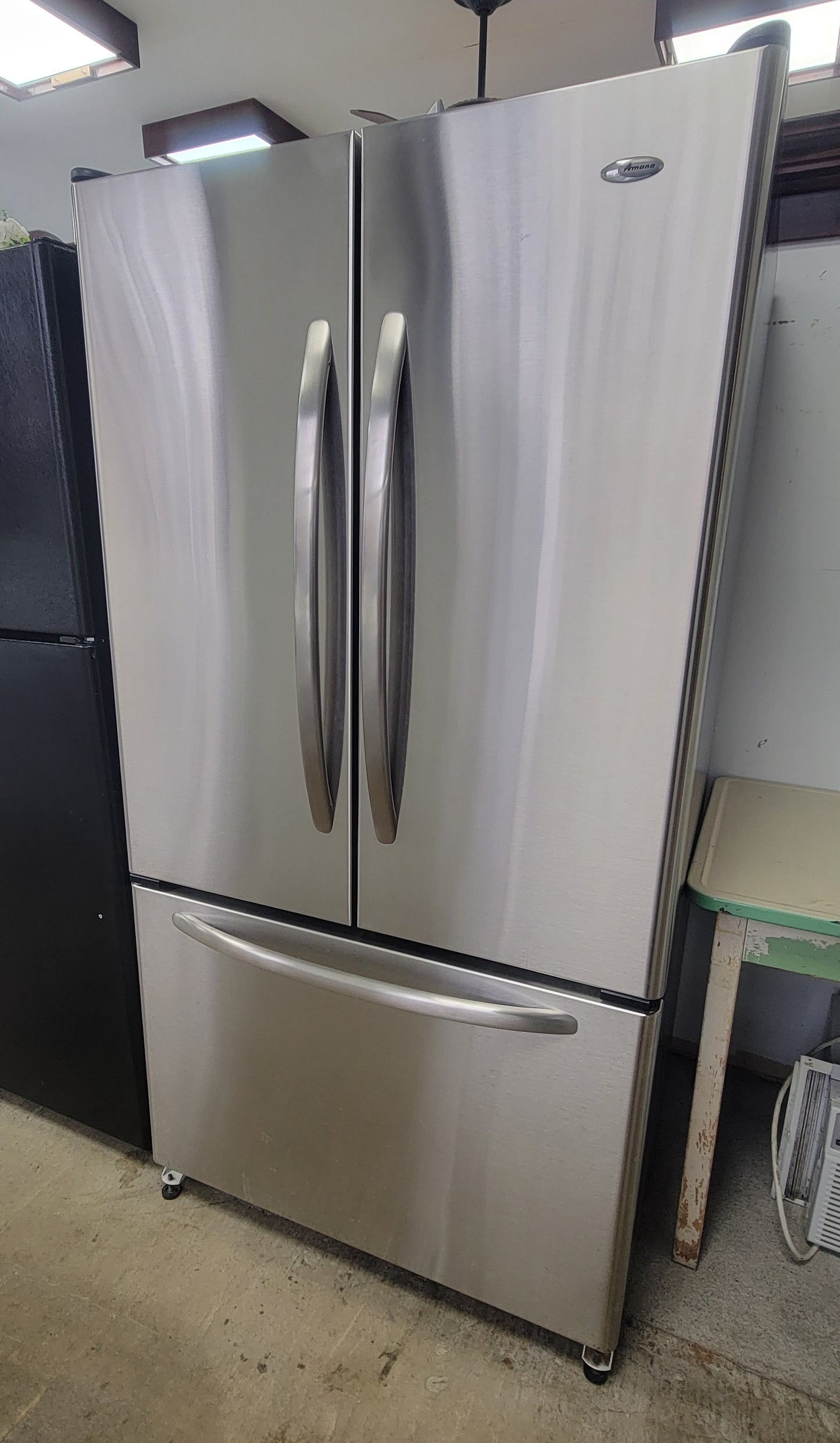 Used Reconditioned Stainless Amana Bottom-mount Refrigerator