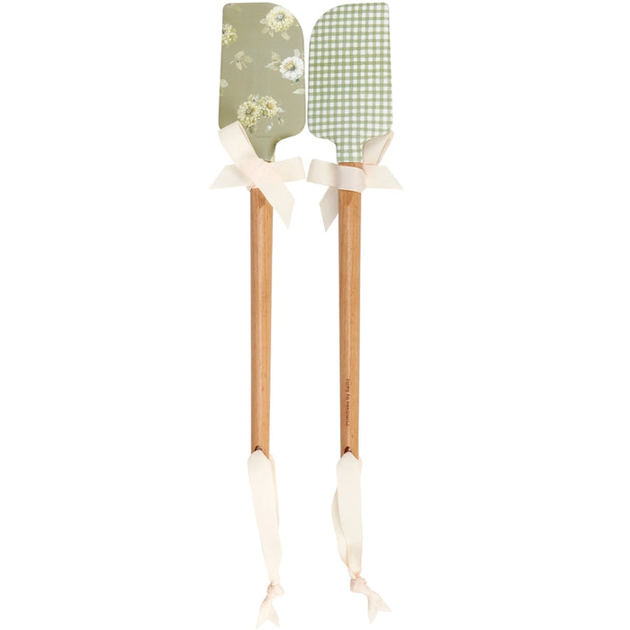 Botanical double-sided silicone spatula with watercolor floral design, gingham pattern, and wooden handle.