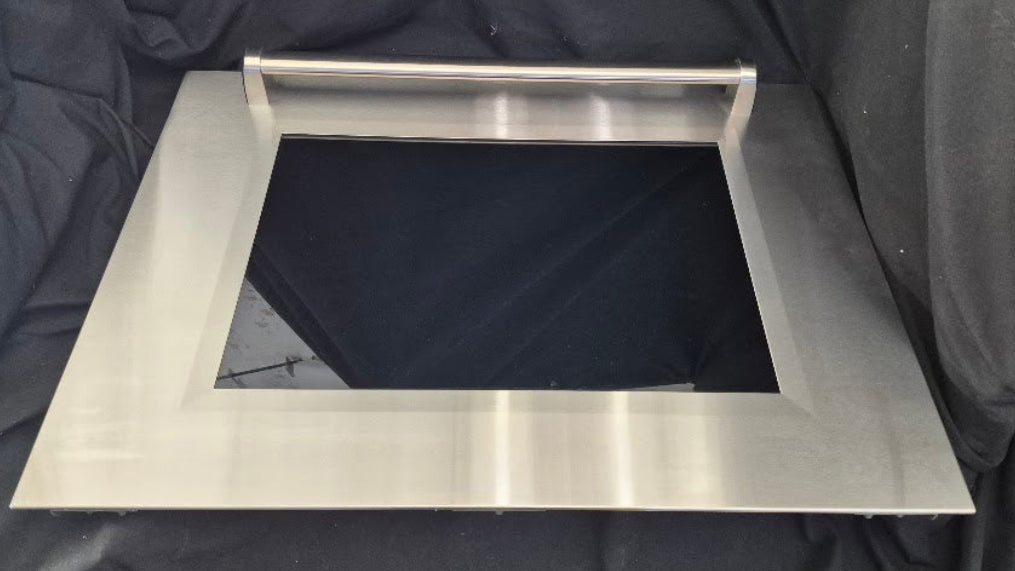 Used Genuine OEM Wolf range stainless steel oven door outer panel skin part 829068 measuring 29-7/8 by 22-1/4 inches.