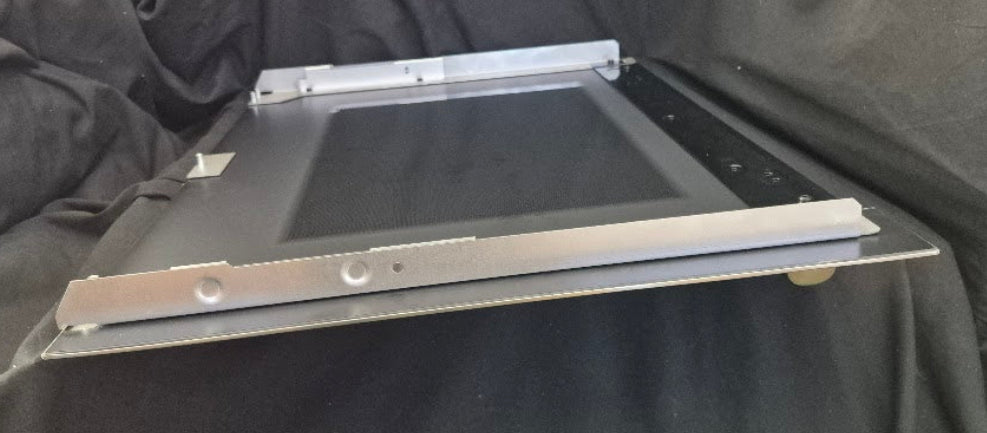 Used Genuine OEM Wolf range stainless steel oven door outer panel skin part 829068 measuring 29-7/8 by 22-1/4 inches 4
